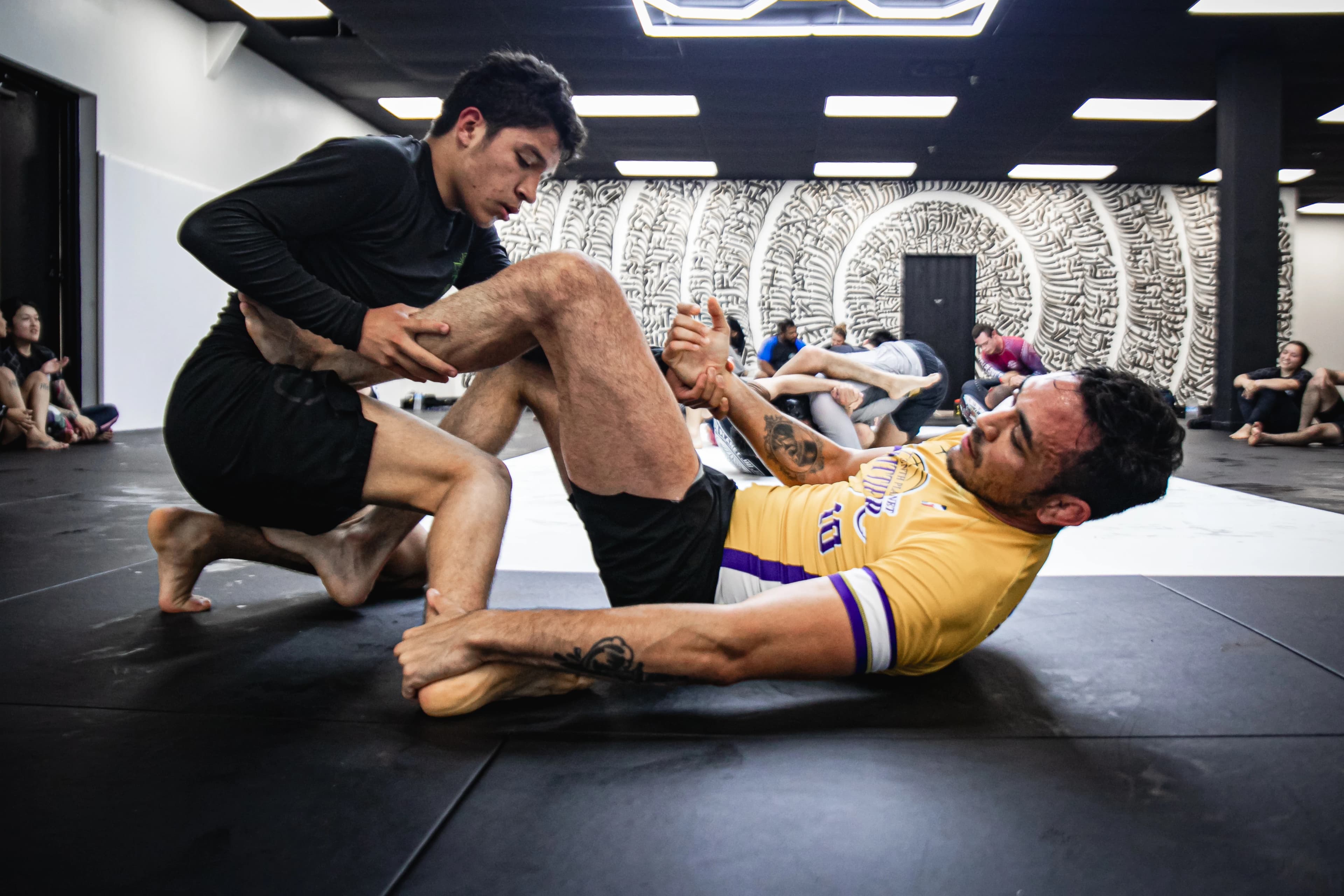 Adult Beginners class on the mats.