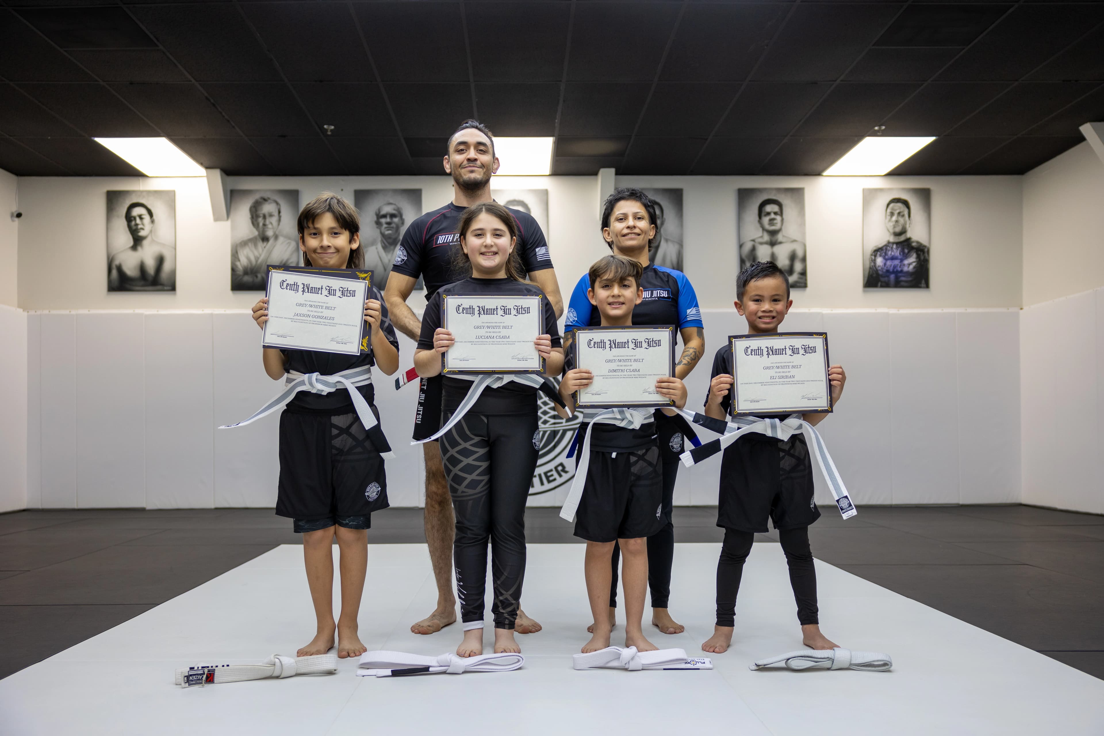 Kids jiu-jitsu class working positions.